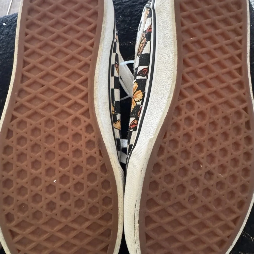 Vans Black and White Low-Top Slip-On Sneakers